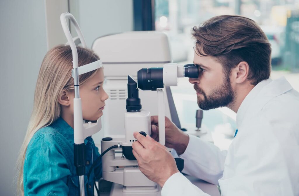 A child having their eyes examined by an eye doctor to monitor for myopia progression.